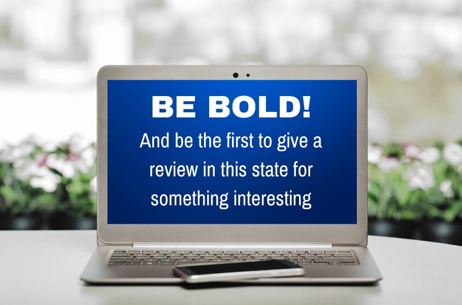 A laptop with the words be bold on it.